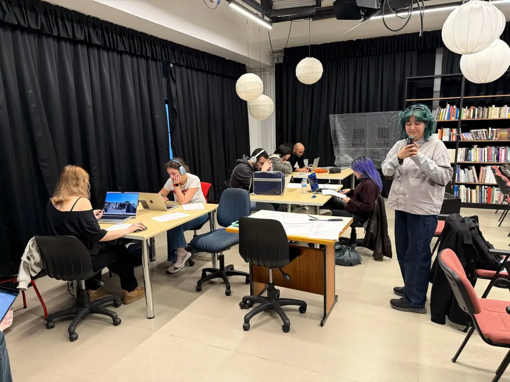 Pilot session — participants editing at workstations in the studio